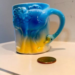 Vintage baby’s ceramic cup with ostrich handle